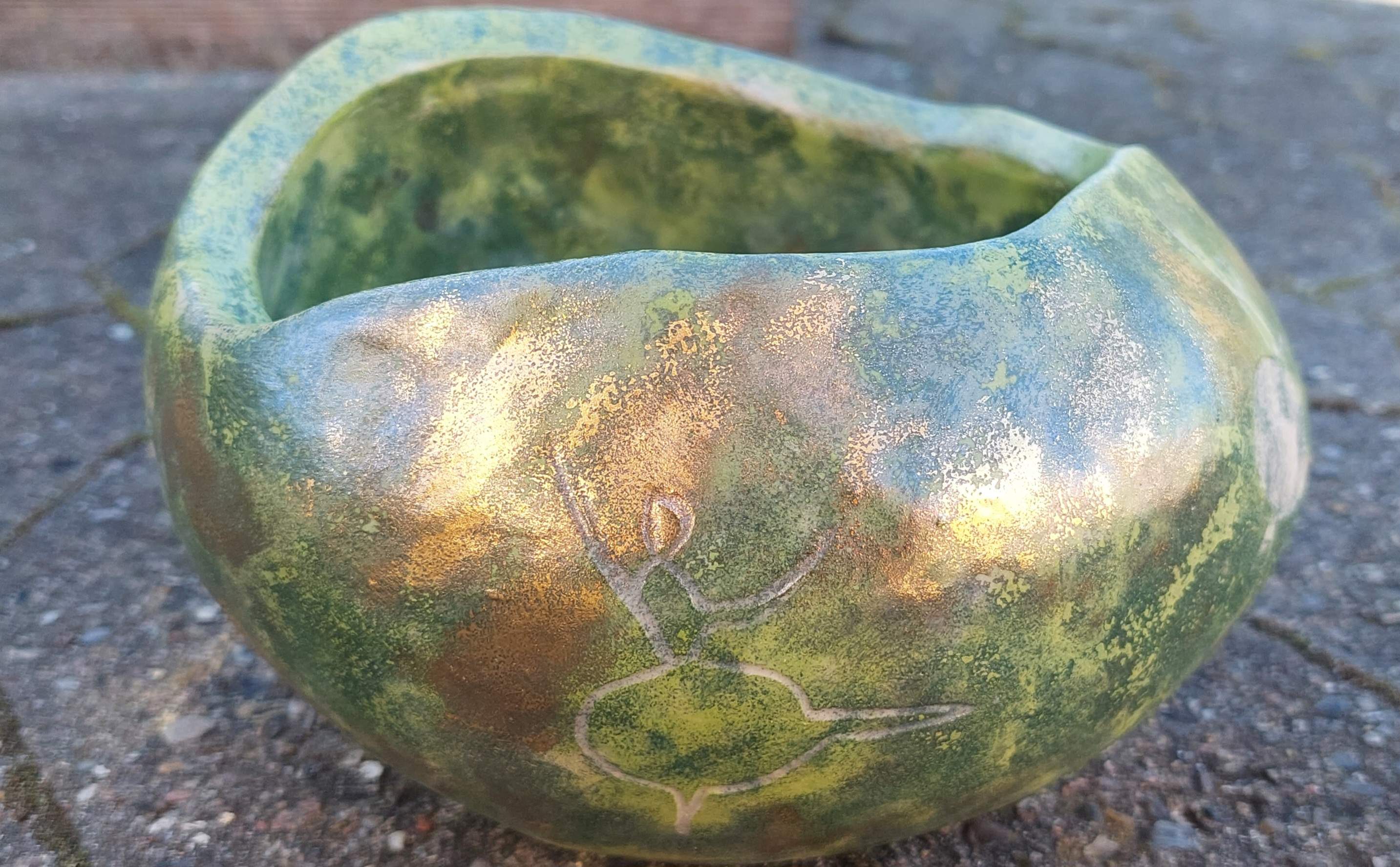 Stoneware with luster and gold. Glass inside
