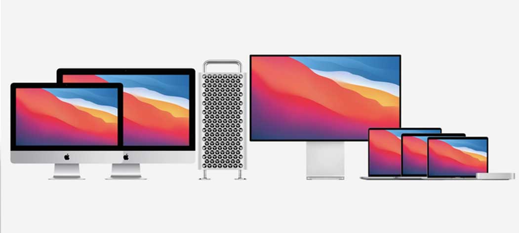 Lineup of Apple computers and devices, including an iMac, Mac Pro with a Pro Display XDR, MacBook Pro laptops in different sizes, and a MacBook Air. All devices display matching wallpaper with a mountainous design in red, orange, and blue hues.