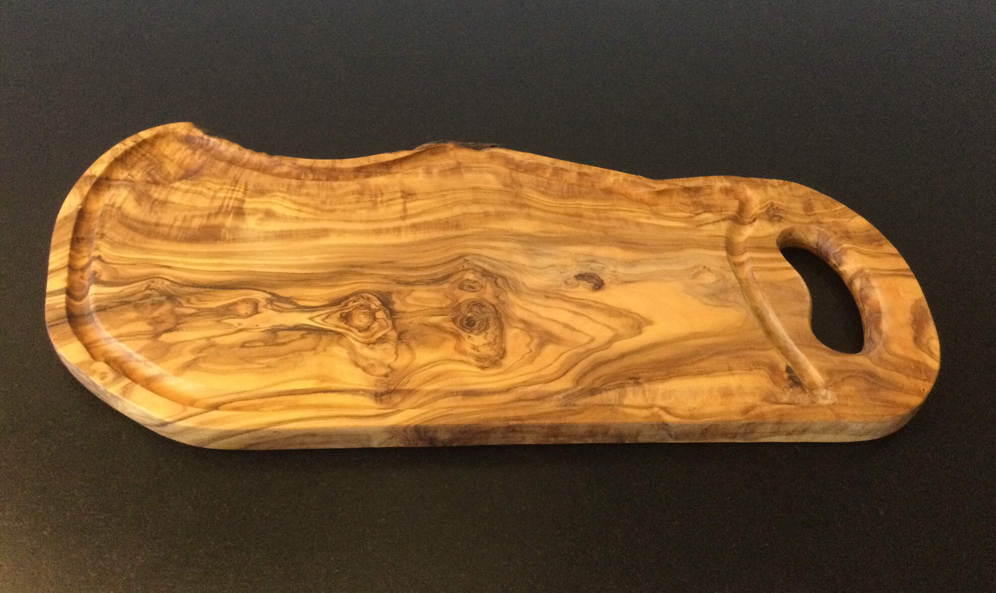 Olive wood: Board with groove and handle.